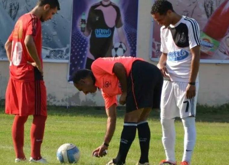 خلال استخدام الرذاذ فى ملعب رفح البلدي ببطولة 